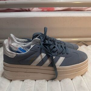 Adidas Gazelle Blue and White Platform Sneakers.